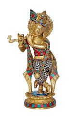 Brass Krishna idol with jeweled inlay details and round decorated base ornament