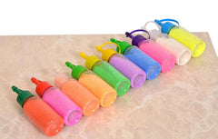 Multicolor rangoli colour powder tubes arranged diagonally with squeeze nozzles