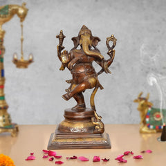 Brass Lord Ganesha dancing statue, holding sacred items, ornate face and arms