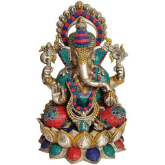 Brass Ganesha idol in kamalasana pose, colorful enamel work on red and blue attire
