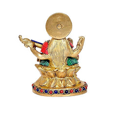 Back of Maa Saraswati sculpture, round halo disk and draped gold garments