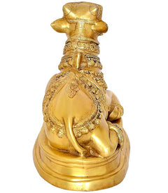 Brass Nandi cow statue idol rear view, detailed robe pattern and circular base