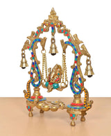 Brass Ganesha swing idol in 3/4 view, multicolor accents on curved pillars and bells