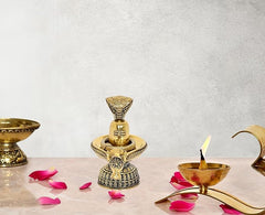 Brass Shiva ling with Nandi figurine on ornate base for Hindu puja decor