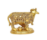 Golden brass cow pooja mandir ornament with calf and small offering pot