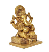 Brass Lord Ganesha idol seated, halo backplate, ornamental details, 7 inch height