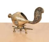 Brass shankh conch on tripod stand with engraved panels along the curved neck