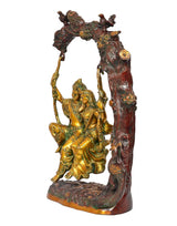 Brass Radha Krishna swing statue idol, side view of seated figures on swing frame