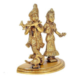 Brass Radha-Krishna statue idol, angled view of two figures with ornate jewelry and base