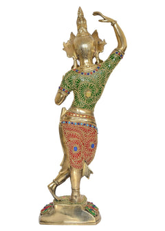Angled view of brass Tara Devi dancer statue with green top and red skirt
