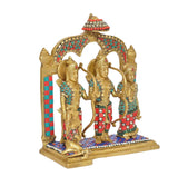 Brass Ram Darbar statue idol angled view, three golden figures in red-and-blue patterned outfits