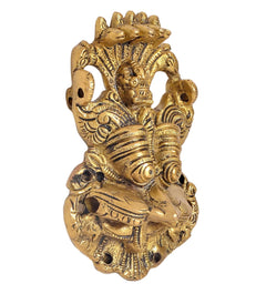 Brass evil eye protection charm with sculpted crown, raised hands, round base