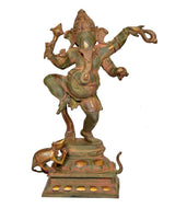 Full view dancing Ganesha murti in greenish brass with detailed ornaments and platform
