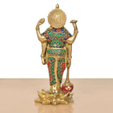Brass Vishnu idol rear view, gold backplate, green and blue bead bands, lotus base.