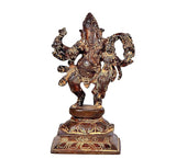 Brass dancing Ganesha statue with Lakshmi figure, front view on ornate pedestal