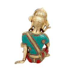 Brass Indra idol, side view with turquoise robe, red patterned sash, 14.5 in