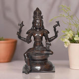 Intricately detailed Lord Shiva statue, seated in prayer with raised trident arms, dark brass finish