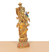 Brass Krishna figurine with peacock feather ornament and flute Meenakari motifs