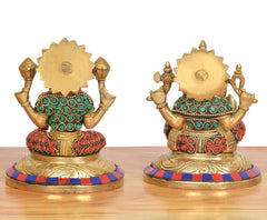 Brass Lakshmi Ganesha statue, back view with gold detailing and red-green patterns.