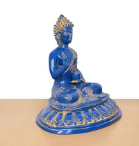 Blue brass Buddha statue seated on round base, angled view, gold ornamentation