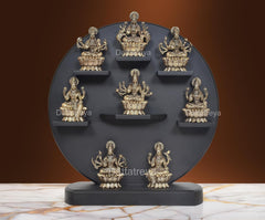 AONA set of 8 brass Ashtalakshmi statues on circular tiered display
