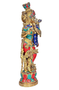 Krishna idol brass figurine from side angle, jeweled crown and painted blue robe
