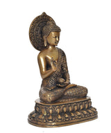 Brass meditating Buddha statue with dhyan mudra hand, calm facial features and halo
