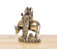 Brass Dattatreya murti side view with elephant and small figure, on decorative base