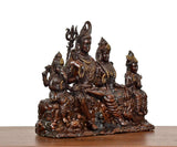 Brass Shiv Parivar statue, three-quarter view of four seated figures with beaded ornaments