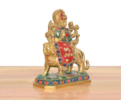 Durga Maa figurine on lion brass statue, red torso, green trim, colorful bead border