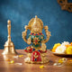 Brass Lakshmi idol statue with arch halo, green sari and red skirt, raised hands
