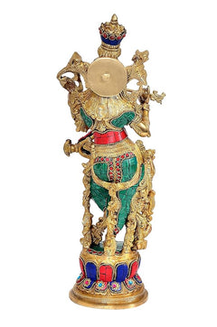 Brass Lord Krishna idol rear view, round golden chest disc with teal and red accents