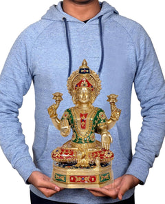 Brass Lakshmi Ganesh statue centered in hands, gold seated figure with ornate crown