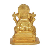 Golden Ganesha statue idol from rear angle, decorative back halo and draped details