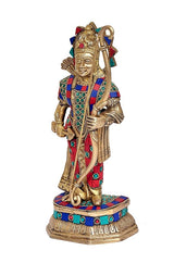 Brass Ram deity statue standing on base, multicolor patterned garment, side angle.