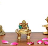 Brass relaxing Ganesha statue, multicolor jeweled trunk and head ornaments