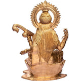 Brass Saraswati statue back view, circular halo and draped attire