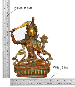 Brass Tara Devi statue, 9 in height; detailed seated figure on green-gold base