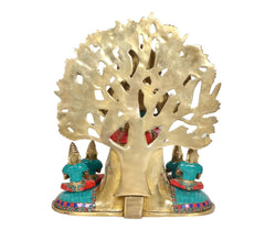 Rear view of brass Dakshinamurti Shiva statue, carved arch halo