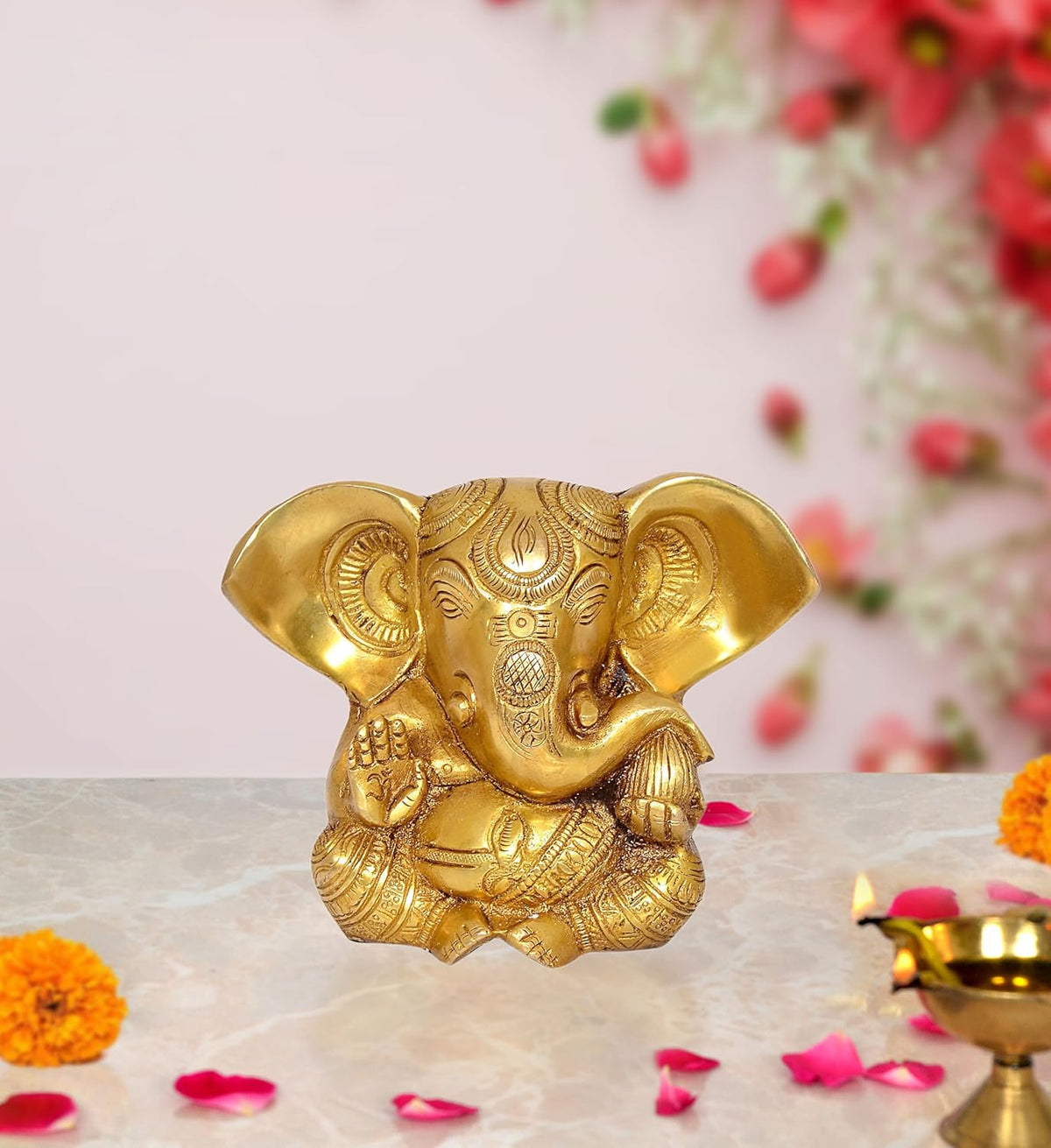Brass Ganesha idol statue with ornate detailing, 5 inch height