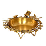 Brass urli dish with gold-toned peacock and leaf detailing, wide oval bowl, 12 in