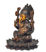 Brass Ganesha on lotus, side angle, holding bowl, detailed arms and crown