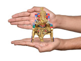 Brass Ganesha statue on chair, reading, held in hands for size