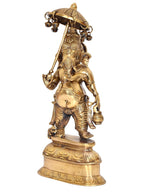 Brass Ganesha idol showpiece holding umbrella, side view with decorative armor details