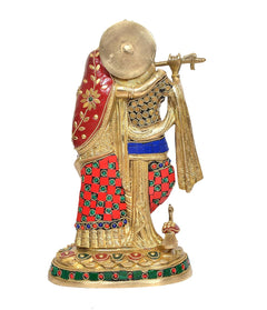 Brass Radha Krishna idol from side view with red drape, blue panels, jeweled detailing