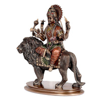 Durga figure on lion, front-right view; multicolour sari and jeweled belt