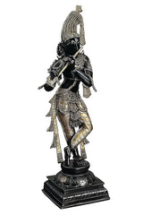 Krishna Murti Idolstatue, seitliche Ansicht, schwarz glänzend mit goldenen Ornamenten