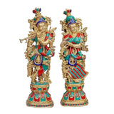 Brass Radha-Krishna idol set, two standing figures in teal, red, and blue-gold attire