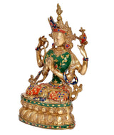 Side view Tara Devi brass idol, seated pose, green blouse, red skirt, ornate gold crown