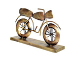 Gold iron bike decorative statue, angled view on rectangular base, 8 inches
